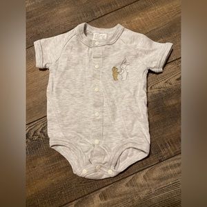 Plain light grey onesie with a bear and bunny on it.